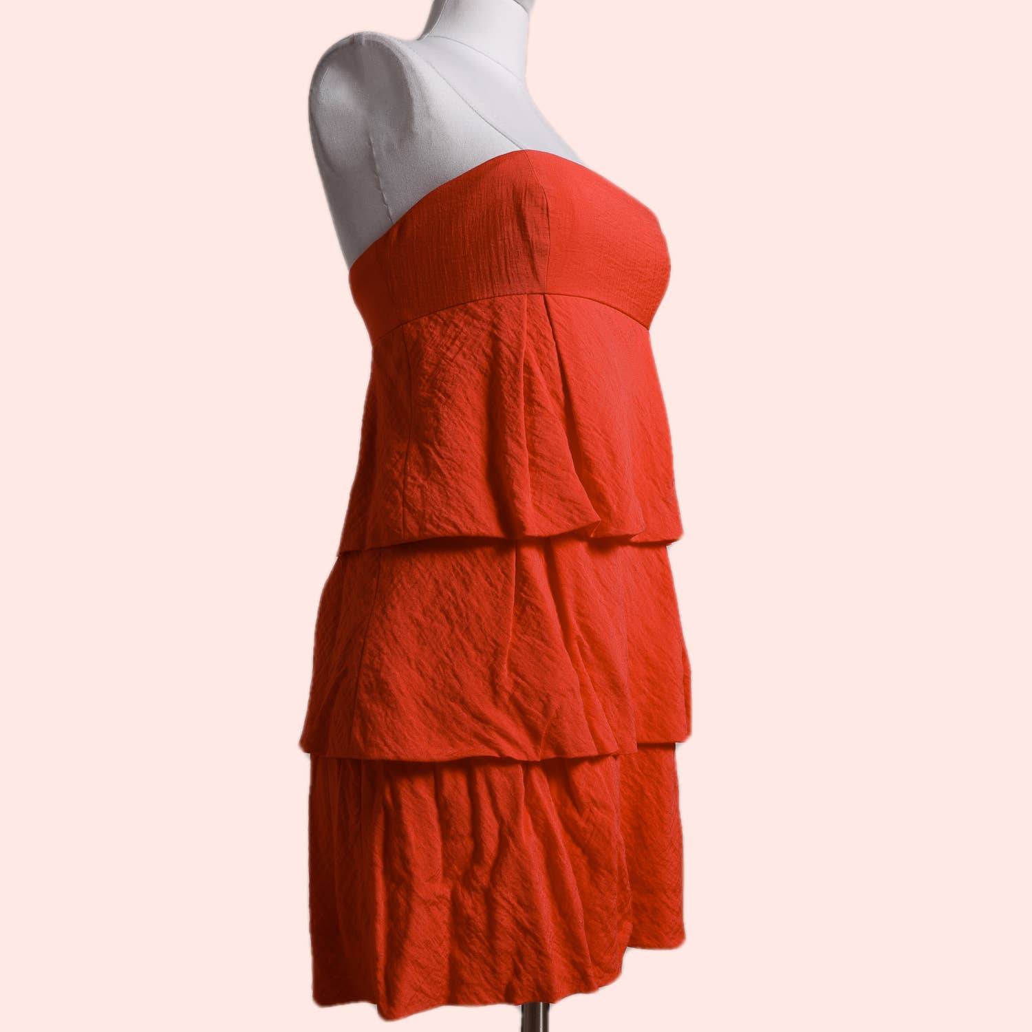 BCBGMAXAZRIA Coral Red Strapless Ruffled Mini Dress The Untitled Boutique BCBGMAXAZRIA Coral Red Strapless Ruffled Mini Dress The Untitled Boutique